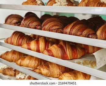 Fresh baked croissants close up in a bakery 