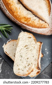 Fresh baked crunchy durum rosemary bread with a decorative score. - Shutterstock ID 2209277783