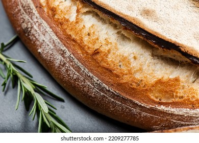 Fresh baked crunchy durum rosemary bread with a decorative score. - Shutterstock ID 2209277785
