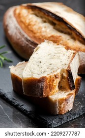 Fresh baked crunchy durum rosemary bread with a decorative score. - Shutterstock ID 2209277787