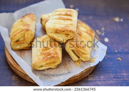 Fresh baked home made  Mini cheese puff pastries.Cheese pie with phyllo pastry and herbs