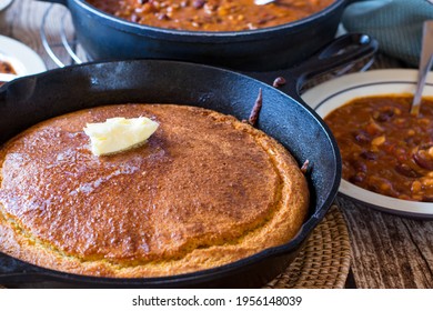 Fresh Baked Homemade Corn Bread With Butter Served With Tex Mex Spicy Bean Stew On Rustic Wooden Table Background At Home For Dinner