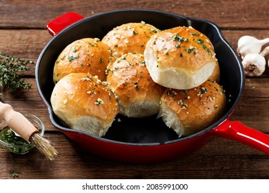 Fresh baked Homemade Garlic Butter Buns. Wooden background - Powered by Shutterstock