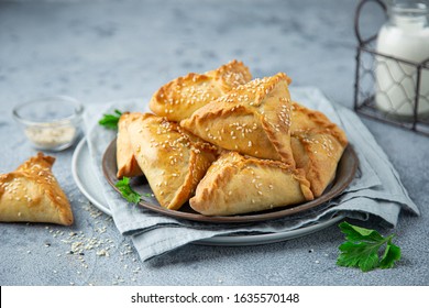 Fresh baked homemade pasties with meat and vegetables. selective focus - Shutterstock ID 1635570148