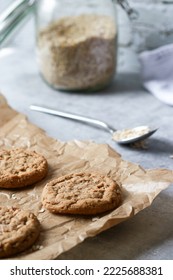 Fresh Baked Oatmeal Cookies On Baking Rack, Milk And Oats In Background. High Quality Photo