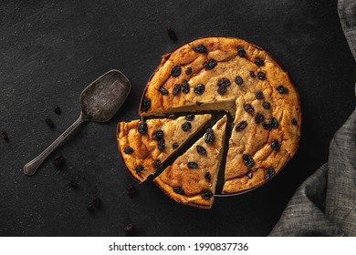 Fresh Baked Raisin Pie On A Black Textured Background, Top View