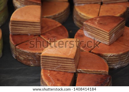 Fresh baked spekkoek, a traditional Indonesian layer cake, made of egg yolks, butter and sugar Stock photo © 