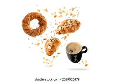 Fresh Baked Turkish Simit Sesame Bagel, French Butter Almond Nut Croissants And Black Cup Hot Coffee Flying With Seeds And Crumbs Isolated On White Background. Pastry Shop Card