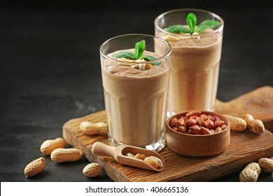 Fresh Banana Cocktail With Chocolate And Peanuts Nuts On Cutting Board
