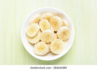 Fresh banana fruits in bowl, top view. - Powered by Shutterstock