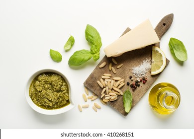 Fresh Basil Pesto Ingredients On White Background Overhead Shoot.