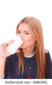 Fresh And Beautiful Woman With Milk Moustache Holding A Glass Of  Milk