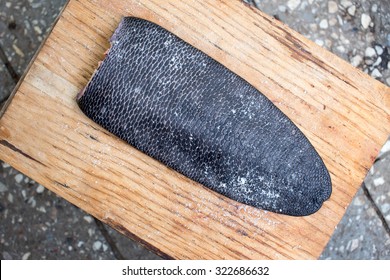 Fresh Beaver Tail With Salt On Rustic Wood