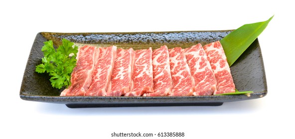 Fresh Beef Chuck Short Ribs On Black Plate, Isolated On White Background