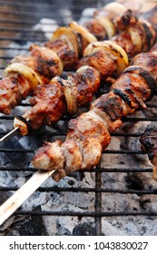 fresh beef meat kebab on barbecue grid grill cooked over burned churcoal