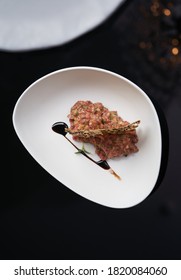 Fresh Beef Tartar With Whole Grain Chips. Raw Tartar Meat In White Plate On Table