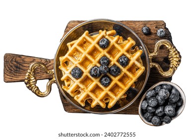 Fresh Belgian waffles with blueberry and Syrup in skillet. Isolated on white background - Powered by Shutterstock