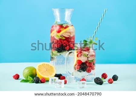 Similar – Infused water in bottles with drink straw and ingredients on white background, front view. Water Flavored with fruits, berries and herbs. Summer drinks. Healthy and clean detox beverages.