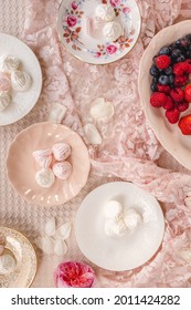 Fresh Berries With Mini Meringues With Pink And White Fine China Plates