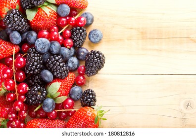 Fresh Berries On Wooden Table