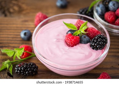 Fresh berry fruit yogurt with forest fruits and mint

