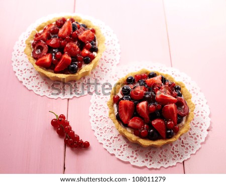 Similar – Image, Stock Photo Delicious strawberry tartlets with vanilla cream in heart shape