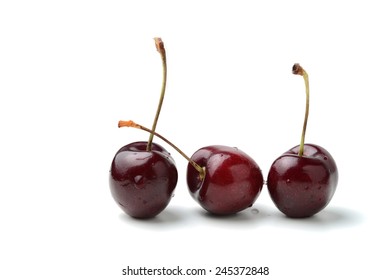 Fresh Black Cherries Isolated On White