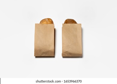 Fresh Black And White Bread In A Brown Kraft Paper Bag Mockup On White Background.High Resolution Photo.