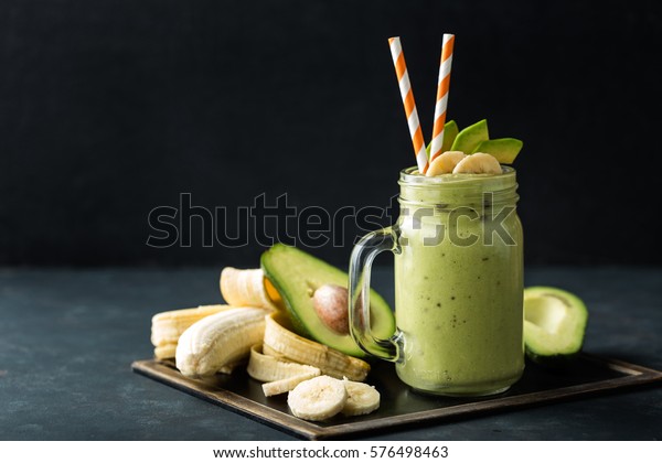 Fresh blended Banana and\
avocado smoothie with yogurt or milk in mason jar, healthy eating,\
superfood