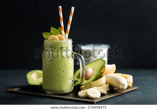 Fresh blended Banana and\
avocado smoothie with yogurt or milk in mason jar, healthy eating,\
superfood