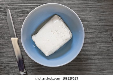 Fresh Block Of Halloumi Cheese In A Bowl