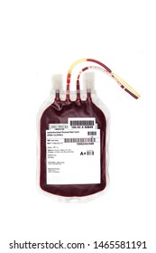 Fresh blood or packed red cells in a transfusion bag, isolated on white background. Labelled A+ group for donation or therapy. Bag of blood with label and blood gropu details.
