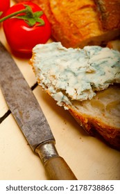 Fresh Blue Cheese Spread Ove French Baguette With Cherry Tomatoes On Side