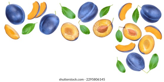 fresh blue plum and half with leaves isolated on white background. Top view. Flat lay
