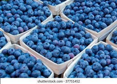 Fresh blueberries in baskets at the market - Shutterstock ID 37751452