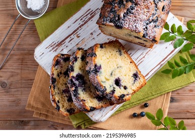 Fresh Blueberry Loaf Of Bread Muffin Cake On Rustic Wooden Table. Horizontal, Top View From Above