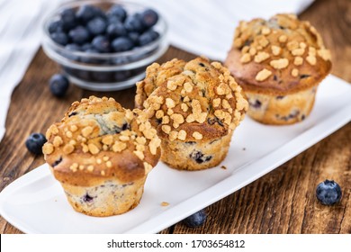 Fresh Blueberry Muffins as detailed close-up shot (selective focus)