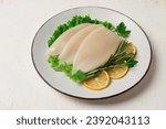 Fresh body, squid, raw, three carcasses, top view, no people, on a plate,