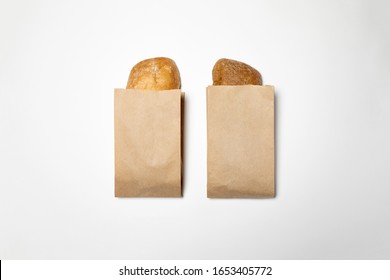 Fresh Bread in a brown kraft Paper Bag Mockup on white background.High resolution photo.