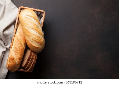 Fresh bread on stone table. Top view with space for your text 