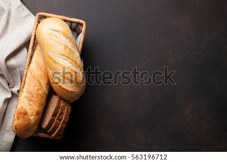 Fresh bread on stone table. Top view with space for your text 