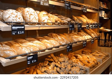 fresh bread and pastries in the salesroom of a bakery - Powered by Shutterstock