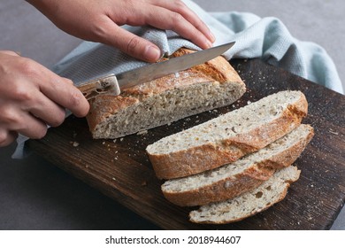 Fresh Bread Slice And Cutting Knife On Table