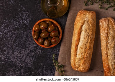 Fresh bread with snacks. Top view with copy space.