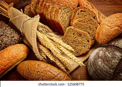 fresh bread  and wheat on the wooden - Powered by Shutterstock