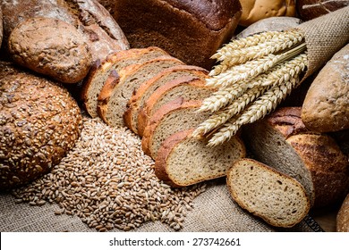 fresh bread  and wheat on the wooden - Shutterstock ID 273742661
