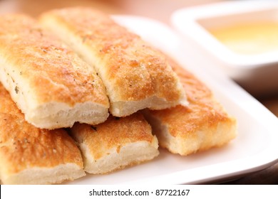 Fresh Breadsticks Served With Dip Sauce.