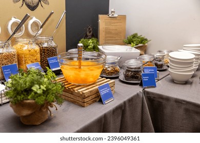 Fresh Breakfast Buffet Setup with Cereal Dispensers and Fruit Bowls in hotel