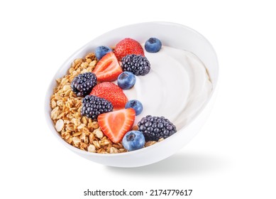 Fresh breakfast with greek yogurt nuts oatmeal granola with berries in a bowl on a white isolated background. the toning. selective focus