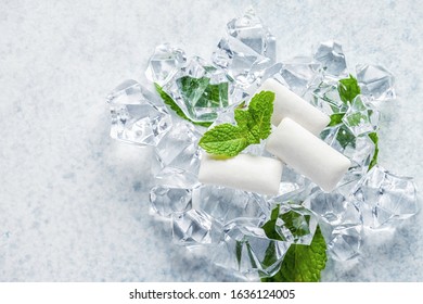 Fresh Breath. Chewing Gum Pads On Ice And Mint Background.